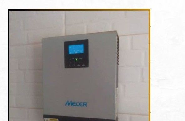 A hybrid inverter being commissioned by a Rayema Enterprise technician